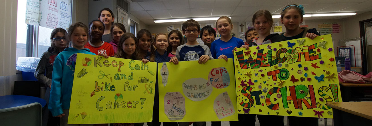 Students holding signs